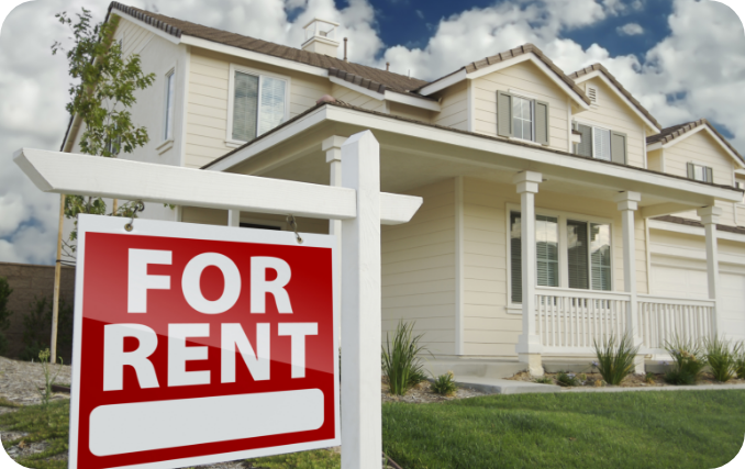 A For Rent sign in front of a single family rental home